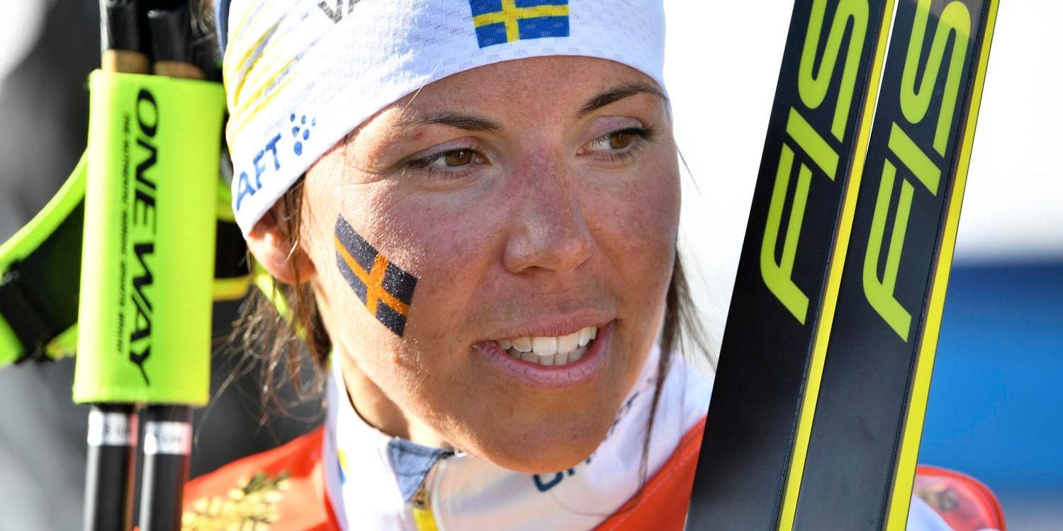Charlotte Kalla hade heller haft jaktstarten kvar i Tour de Ski Arkivbild.