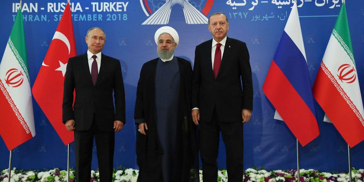 Rysslands president Vladimir Putin (till vänster, Irans president Hassan Rohani (mitten) och Turkiets president Recep Tayyip Erdogan i Teheran.