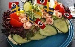 Nazisten som lade ut bilden på smörgåstårtan med hakkorsflaggor - som Stina Isaksson blev FB-vän med i år – uteslöts förra året från Sverigedemokraterna efter att medlemsutskottet granskat hans Facebook-inlägg om Hermann Göring.