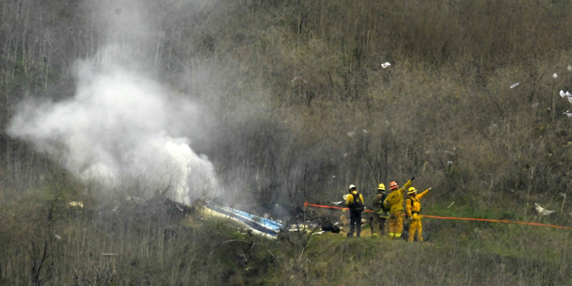 Räddningsarbetare vid helikopterkraschen där nio personer omkom. 